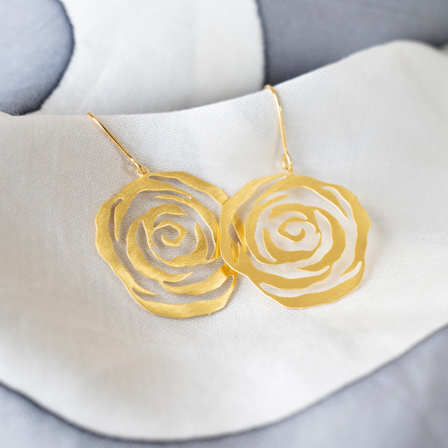 Gold rose-shaped earrings