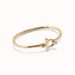 Uno de 50 gold plated t-bar bangle bracelet with topaz