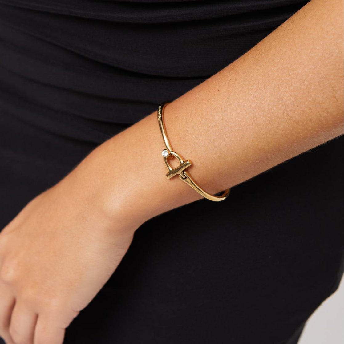 Uno de 50 gold plated t-bar bangle with topaz