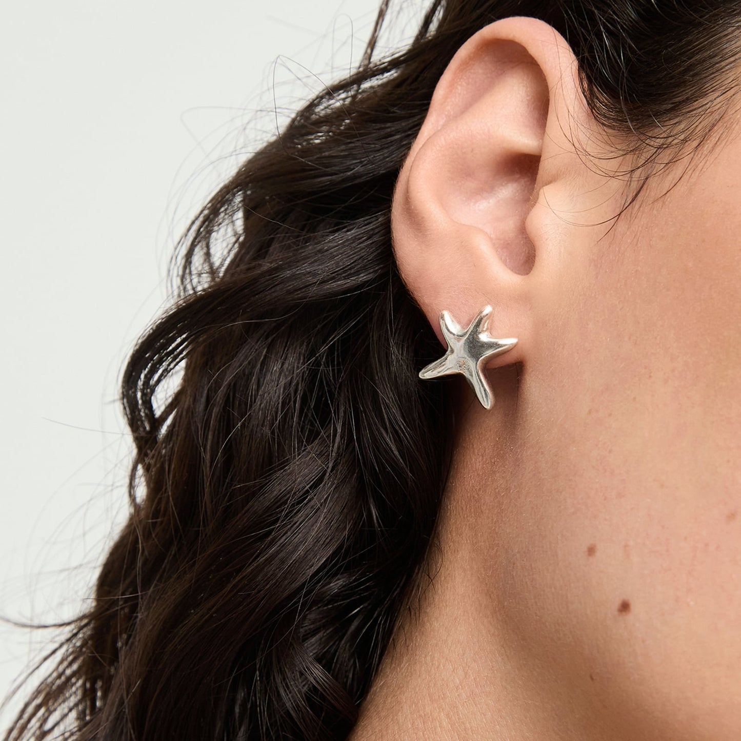 unode50 silver starfish stud earrings