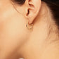 uno de 50 gold plated hoop earrings